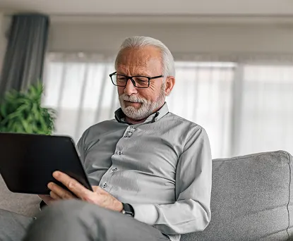 Person working on tablet at home