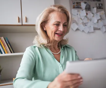 Person working on tablet at home